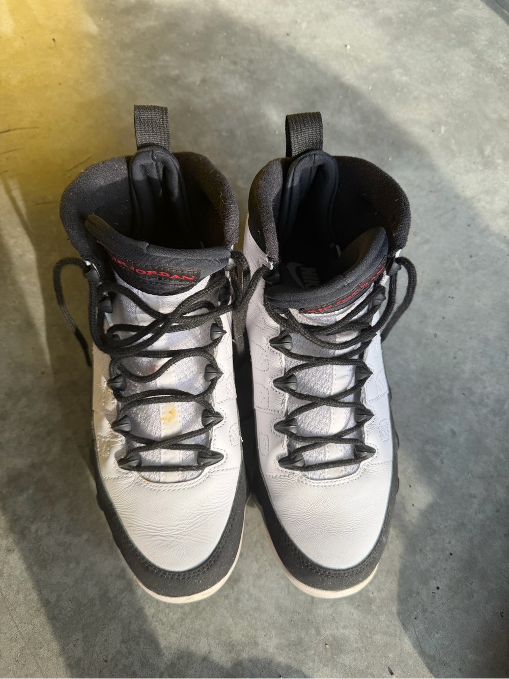 Jordan Men’s White and Black High-Top Athletic Sneakers with Red Accents